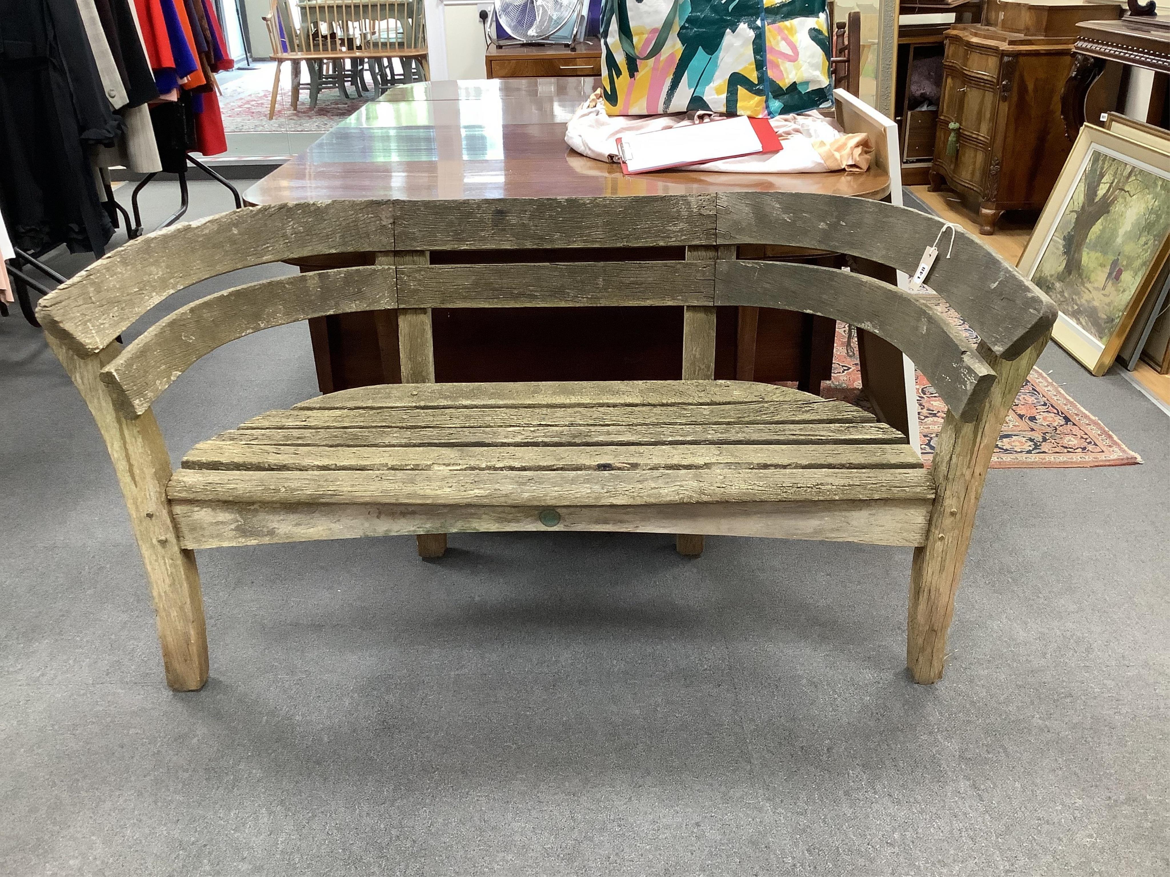 A Gaze Burvill steam bent oak “Court” garden bench, width 146cm, depth 58cm, height 79cm. Condition - fair